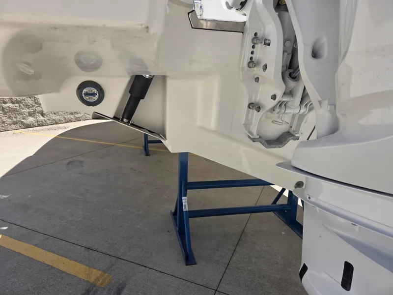 Slide: The Image of 2025 Pursuit S 288 Sport boat hull on stand, showcasing detailed construction. - 36