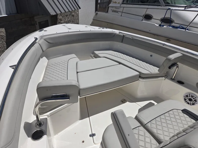 Slide: The Image of 2025 Pursuit S 288 Sport boat interior with cushioned seating and modern design. - 6