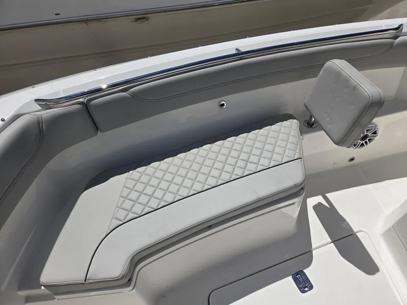 Slide: The Image of 2025 Pursuit S 288 Sport boat interior with quilted seating and sleek design. - 7