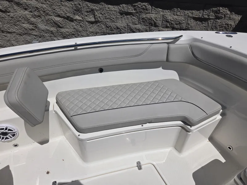 Slide: The Image of 2025 Pursuit S 288 Sport boat interior with cushioned seating and sleek design. - 8