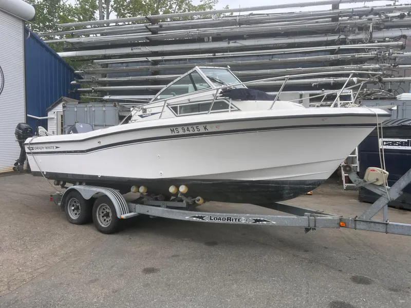 Slide: The Image of 1992 Grady-White 22 Seafarer boat on trailer, parked outdoors. - 1
