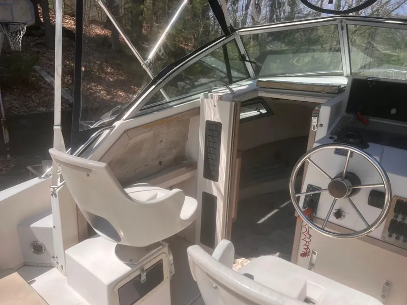 Slide: The Image of 1992 Grady-White 22 Seafarer boat interior with steering wheel and seating. - 13
