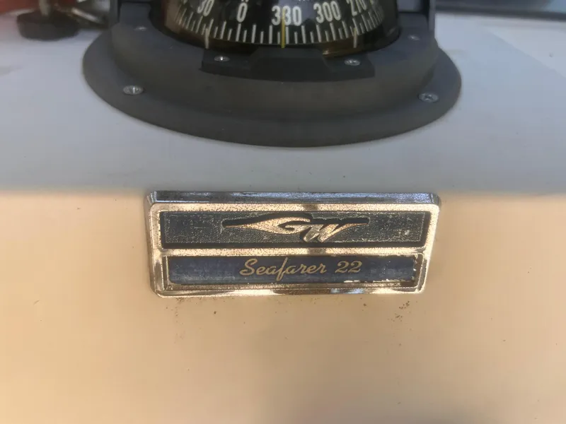 Slide: The Image of 1992 Grady-White 22 Seafarer boat emblem with compass in background. - 19