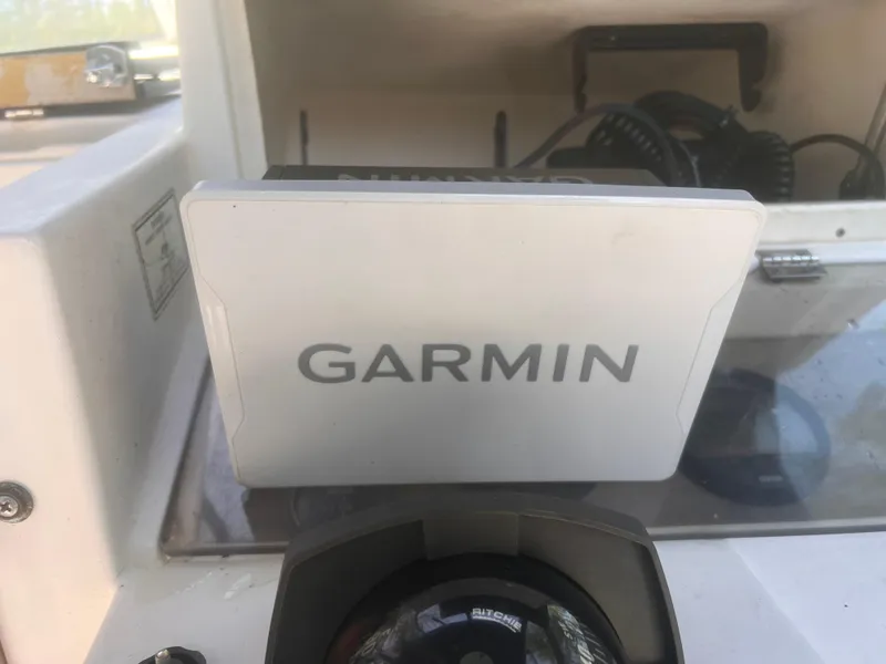 Slide: The Image of Garmin device on 1992 Grady-White 22 Seafarer boat dashboard. - 21