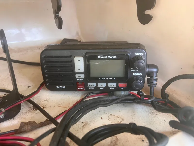 Slide: The Image of VHF radio on 1992 Grady-White 22 Seafarer boat, featuring West Marine model VHF580. - 22