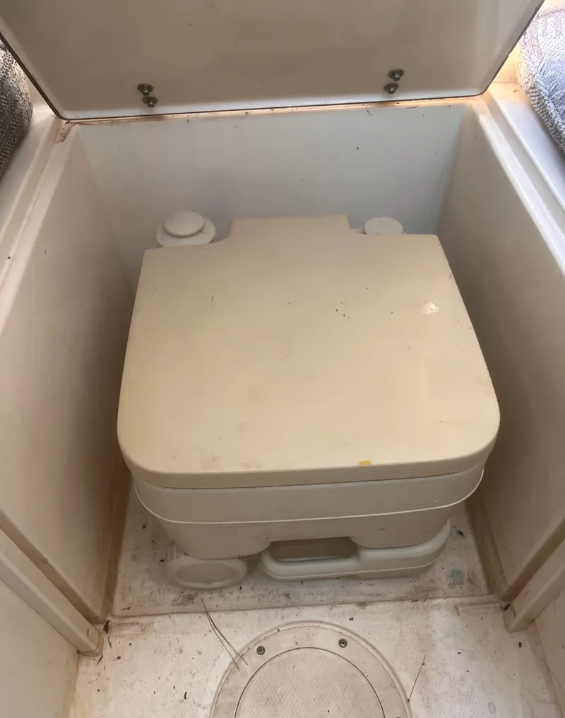 Slide: The Image of Portable toilet in 1992 Grady-White 22 Seafarer boat cabin. - 24