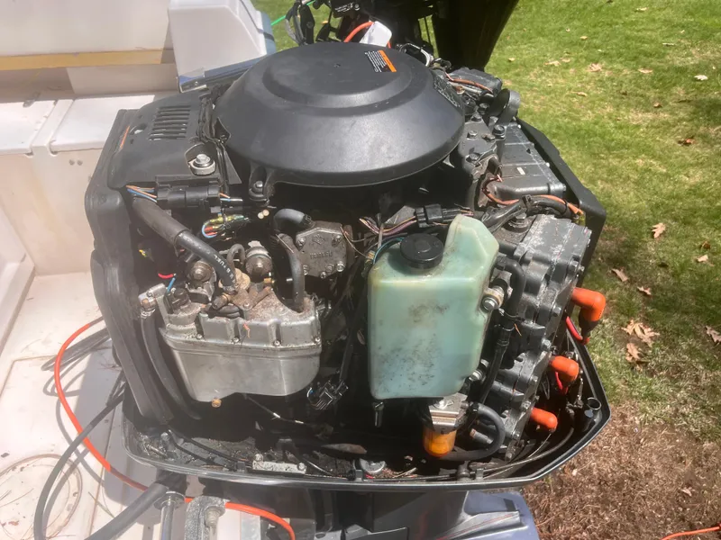Slide: The Image of 1992 Grady-White 22 Seafarer boat engine, detailed view, outdoors. - 32
