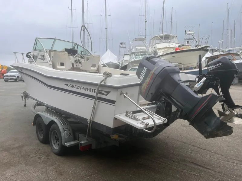 Slide: The Image of 1992 Grady-White 22 Seafarer boat on trailer, docked with outboard motor. - 4