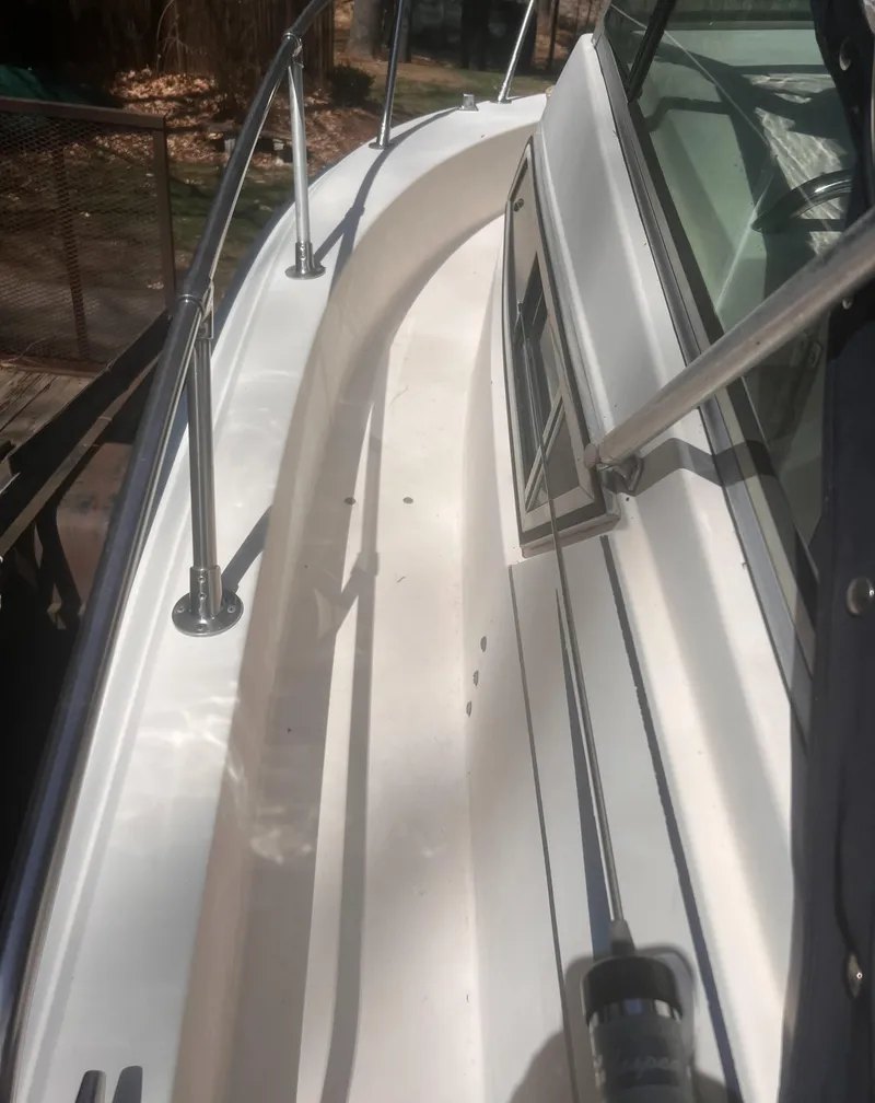 Slide: The Image of 1992 Grady-White 22 Seafarer boat deck with stainless steel railings. - 8