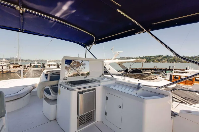 Slide: The Image of Luxurious 2009 Sunseeker Manhattan 70 yacht interior with modern amenities and scenic marina view. - 11