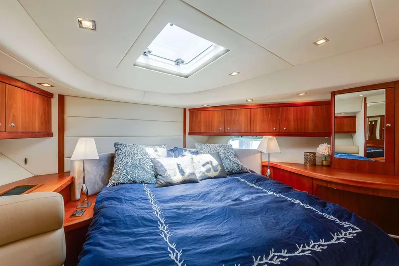 Slide: The Image of Luxurious bedroom interior of 2009 Sunseeker Manhattan 70 yacht with elegant wood finishes. - 22