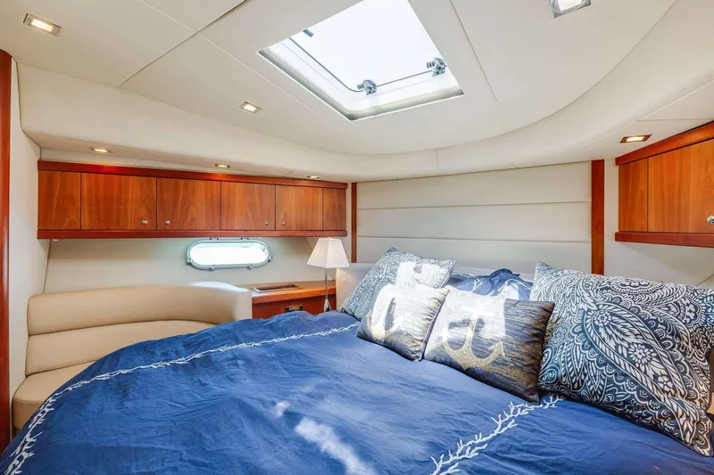Slide: The Image of Luxurious cabin interior of 2009 Sunseeker Manhattan 70 yacht with skylight and elegant bedding. - 23