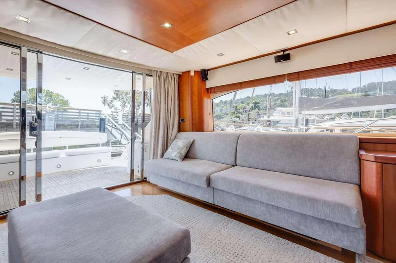 Slide: The Image of Luxurious interior of 2009 Sunseeker Manhattan 70 yacht with modern sofa and large windows. - 39