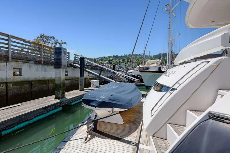 Slide: The Image of Sunseeker Manhattan 70 yacht docked at marina, 2009 model, sunny day. - 4