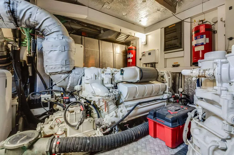 Slide: The Image of Engine room of 2009 Sunseeker Manhattan 70 yacht, featuring complex machinery and fire safety equipment. - 41