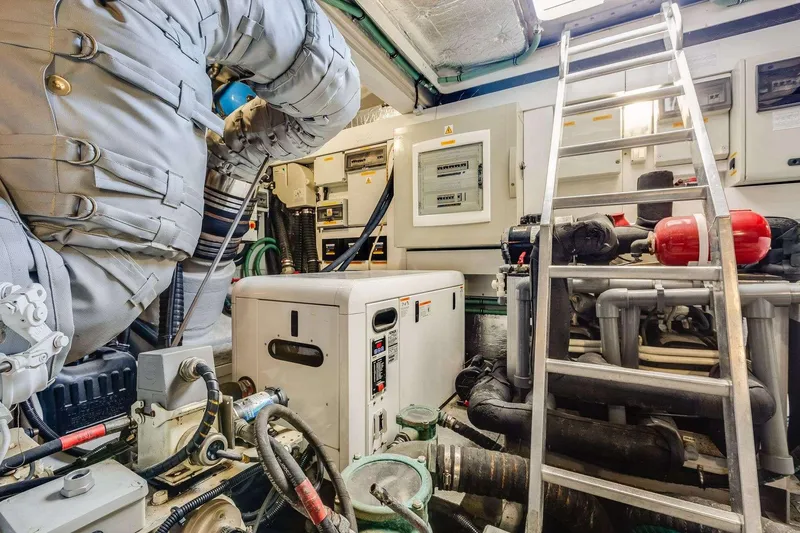 Slide: The Image of Engine room of 2009 Sunseeker Manhattan 70 yacht with equipment and ladder. - 43