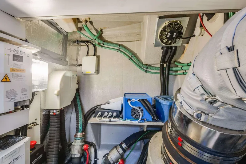 Slide: The Image of Engine room of 2009 Sunseeker Manhattan 70 yacht with wiring and mechanical components. - 44