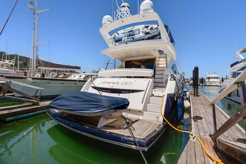 Slide: The Image of 2009 Sunseeker Manhattan 70 yacht docked in marina, rear view. - 56
