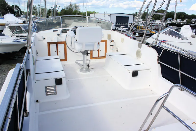 Slide: The Image of Island Gypsy 32 yacht deck, 2000 model, featuring spacious seating and helm station. - 16