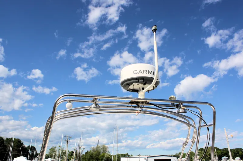 Slide: The Image of Radar equipment on Island Gypsy 32 boat, 2000 model, under a clear blue sky. - 19