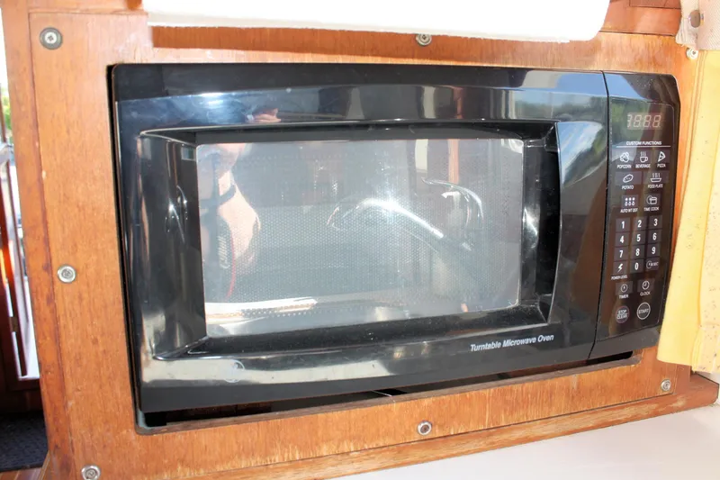 Slide: The Image of Built-in microwave oven on Island Gypsy 32, 2000 model, with wooden cabinetry. - 47