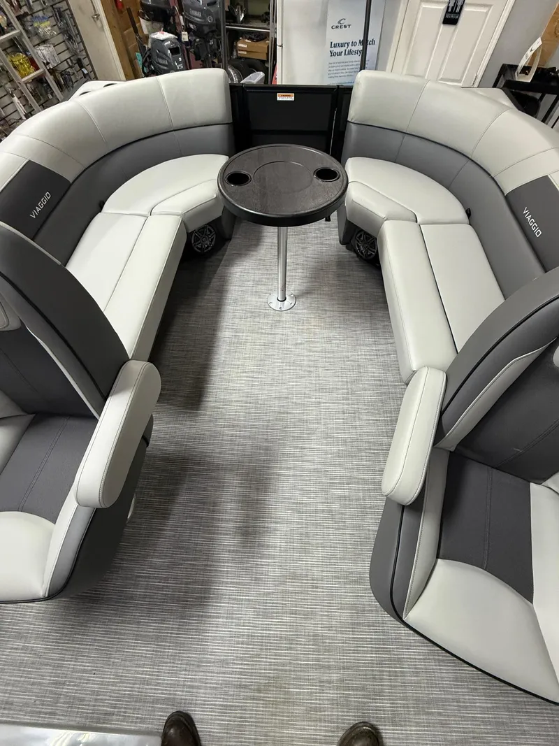 Slide: The Image of Luxurious Viaggio V20U 2025 boat interior with gray seating and central table. - 10