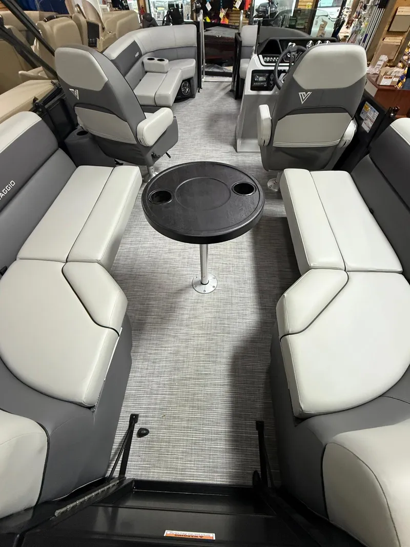 Slide: The Image of Interior of 2025 Viaggio V20U boat with gray seating and central table. - 11