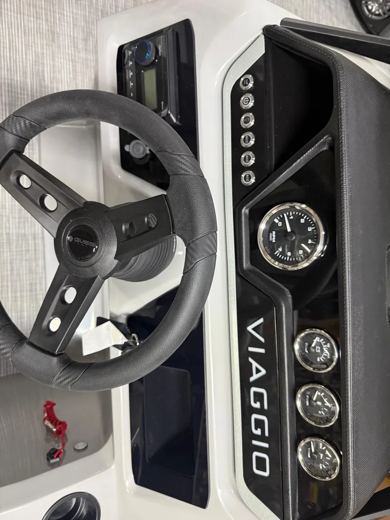 Slide: The Image of Viaggio V20U 2025 dashboard with steering wheel and gauges, showcasing modern design. - 13