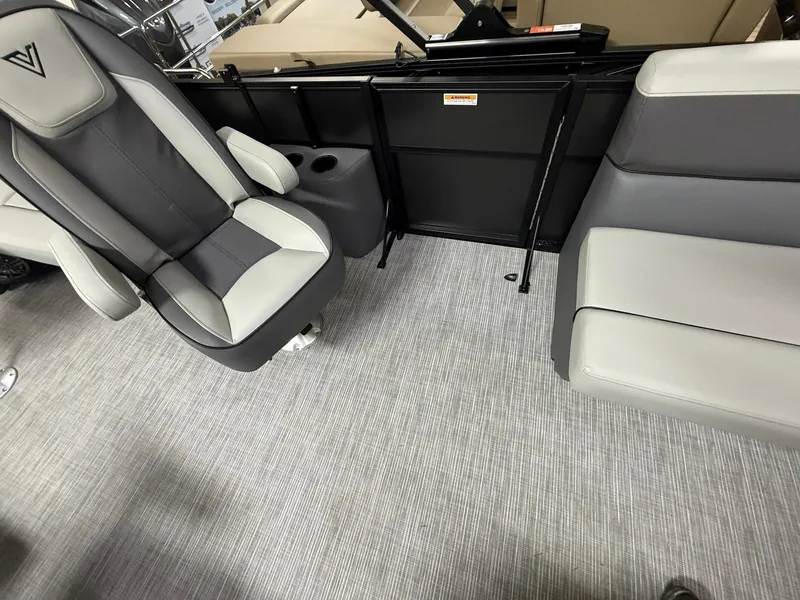 Slide: The Image of Interior of 2025 Viaggio V20U boat with gray seating and carpeted floor. - 16