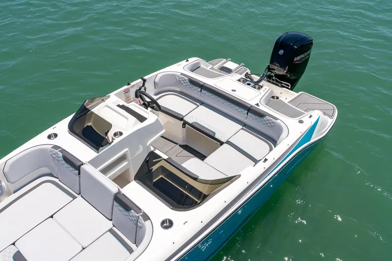 Slide: The Image of 2024 Bayliner M17 boat with spacious seating on calm water. - 10