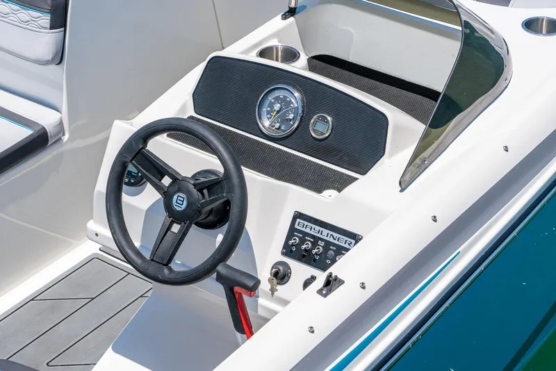 Slide: The Image of 2024 Bayliner M17 boat dashboard with steering wheel and instrument panel. - 12
