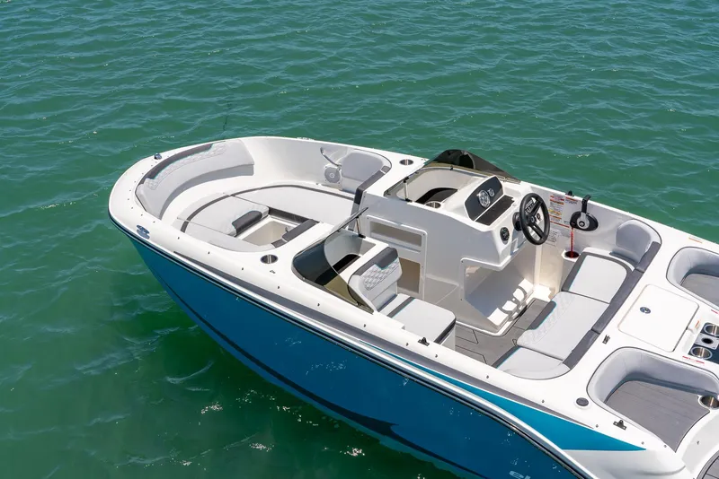 Slide: The Image of 2024 Bayliner M17 boat on clear water, showcasing sleek design and spacious seating. - 14