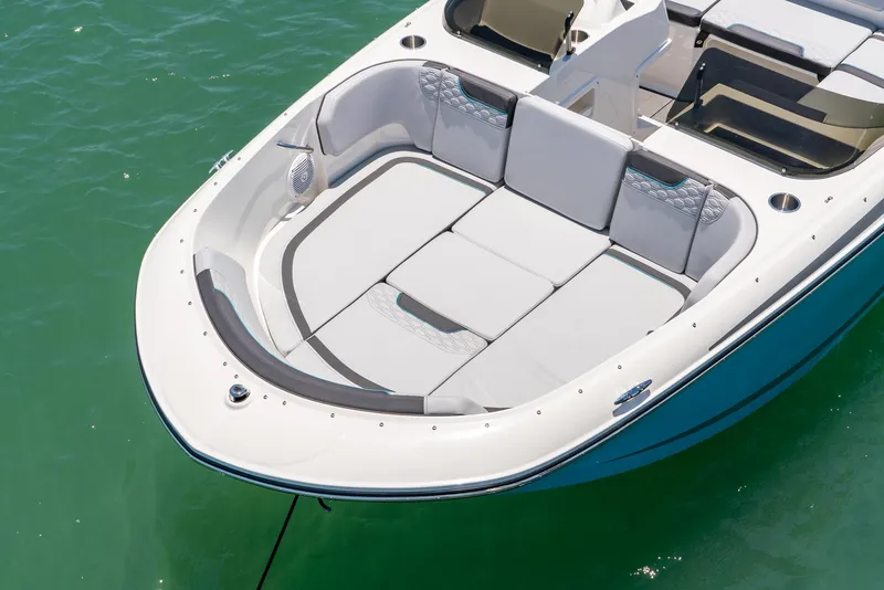 Slide: The Image of 2024 Bayliner M17 boat with spacious seating on calm water. - 16