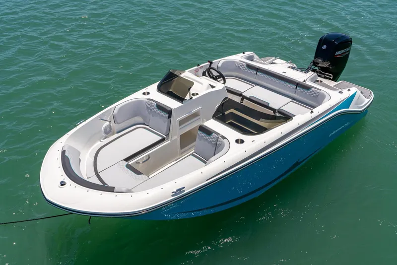 Slide: The Image of 2024 Bayliner M17 boat on clear water, showcasing sleek design and spacious seating. - 6