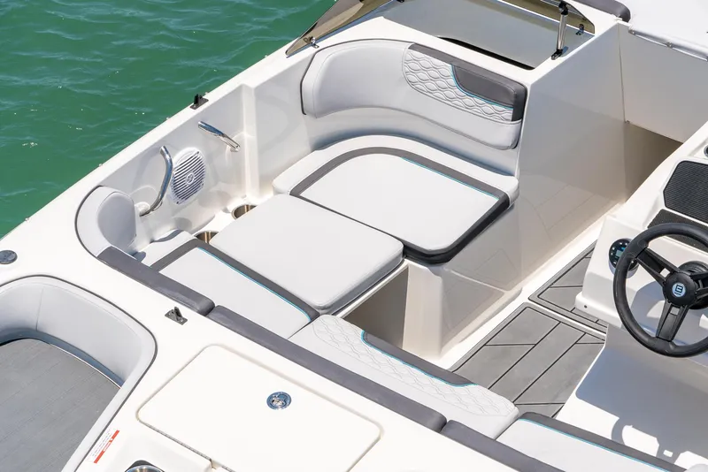 Slide: The Image of 2024 Bayliner M17 boat interior with white seating and modern design. - 9