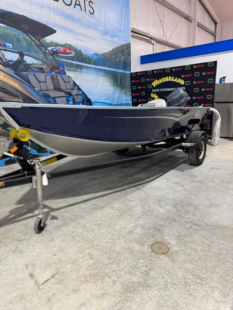 The Image of 2024 G3 V150T Guide boat on trailer in showroom setting. - 1