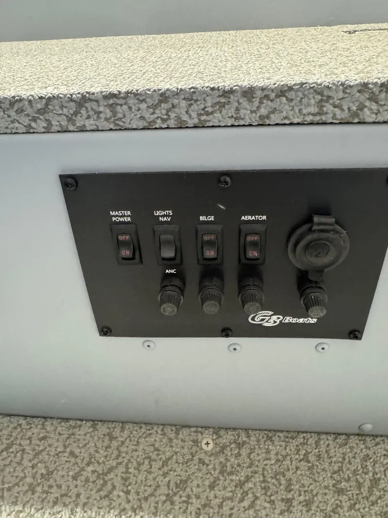 Slide: The Image of Control panel of 2024 G3 V150T Guide boat with switches and power outlet. - 6