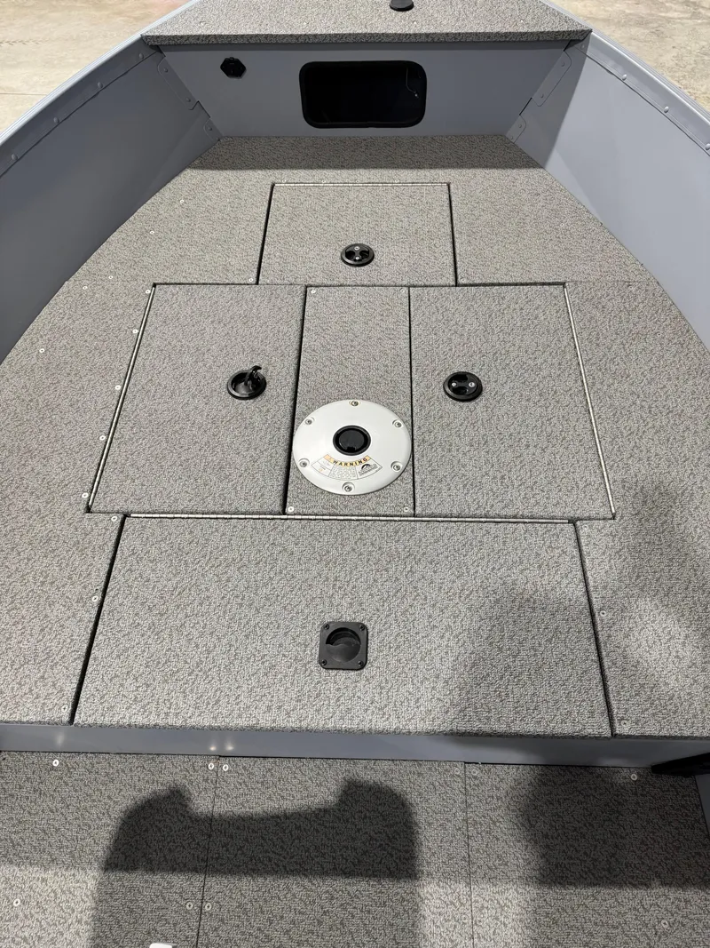 Slide: The Image of 2024 G3 V150T Guide boat interior with storage compartments and textured flooring. - 7