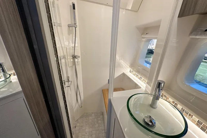 Slide: The Image of Luxurious bathroom in 2025 Sea Ray Sundancer 370 yacht with modern fixtures. - 21