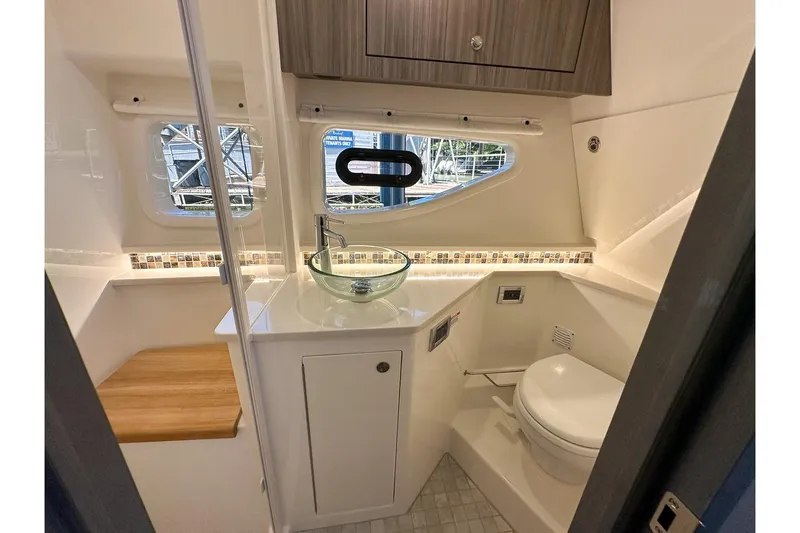 Slide: The Image of Luxurious bathroom interior of 2025 Sea Ray Sundancer 370 yacht with modern fixtures. - 23