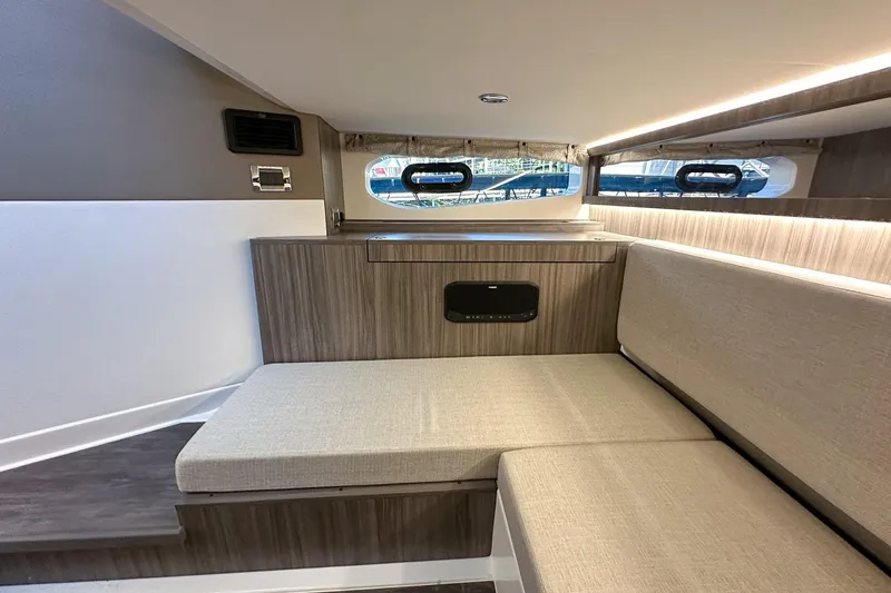Slide: The Image of Interior of 2025 Sea Ray Sundancer 370, featuring modern seating and sleek design. - 28