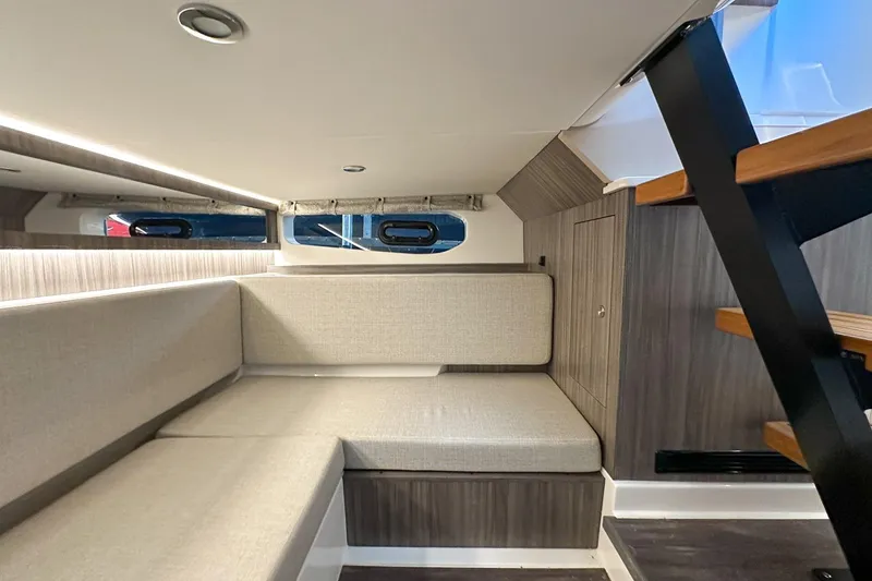 Slide: The Image of Interior of 2025 Sea Ray Sundancer 370, featuring modern seating and sleek design elements. - 29