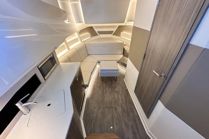 Slide: The Image of Interior of 2025 Sea Ray Sundancer 370 yacht, featuring modern design and cozy seating area. - 33