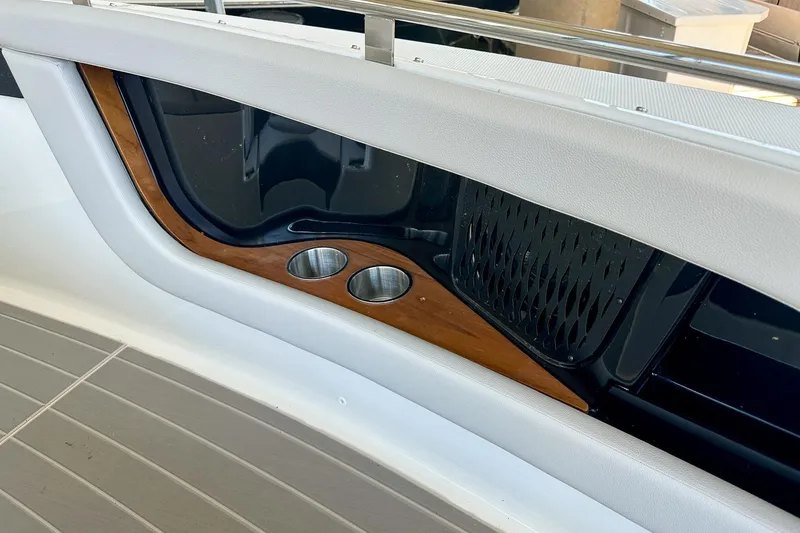 Slide: The Image of 2025 Sea Ray Sundancer 370 interior detail with cup holders and sleek design. - 43