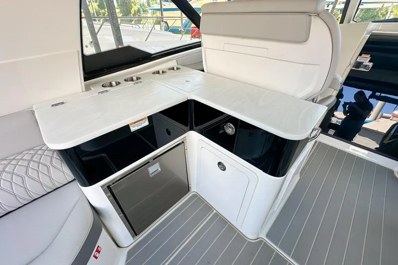 Slide: The Image of 2025 Sea Ray Sundancer 370 interior with sleek kitchenette and modern design. - 50