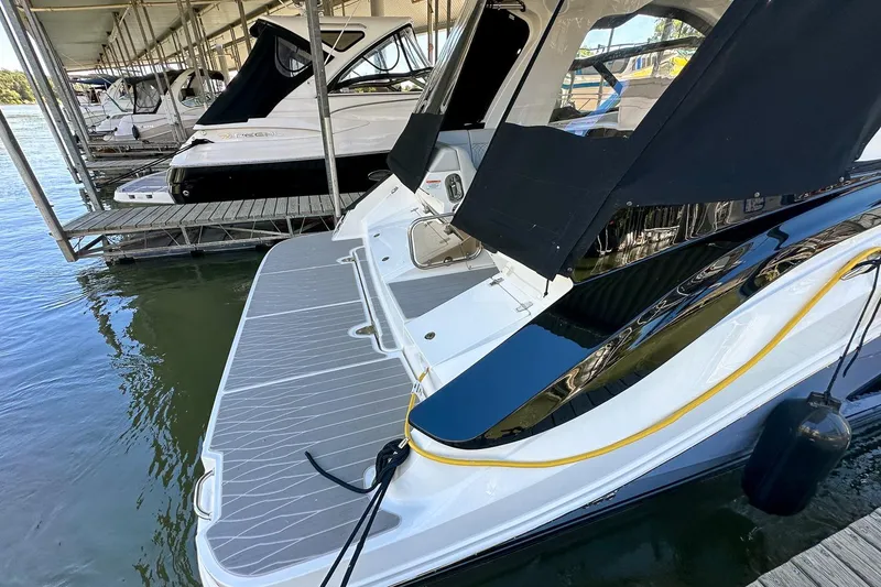 Slide: The Image of 2025 Sea Ray Sundancer 370 docked, showcasing sleek design and modern features. - 53