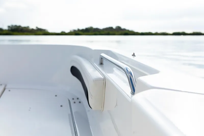 Slide: The Image of 2023 Bayliner Trophy 20CC boat interior with sleek design and chrome railing. - 20