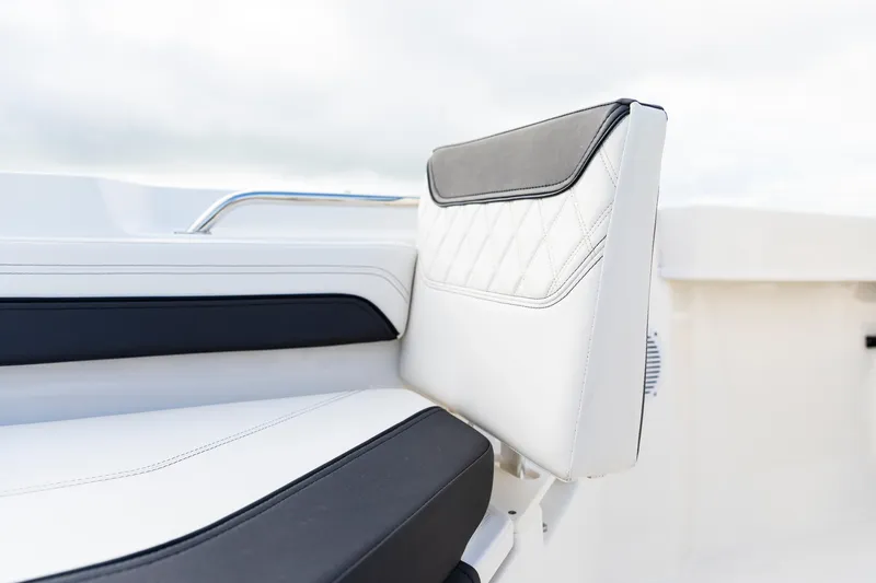 Slide: The Image of 2023 Bayliner Trophy 20CC boat seat with white and black upholstery. - 23