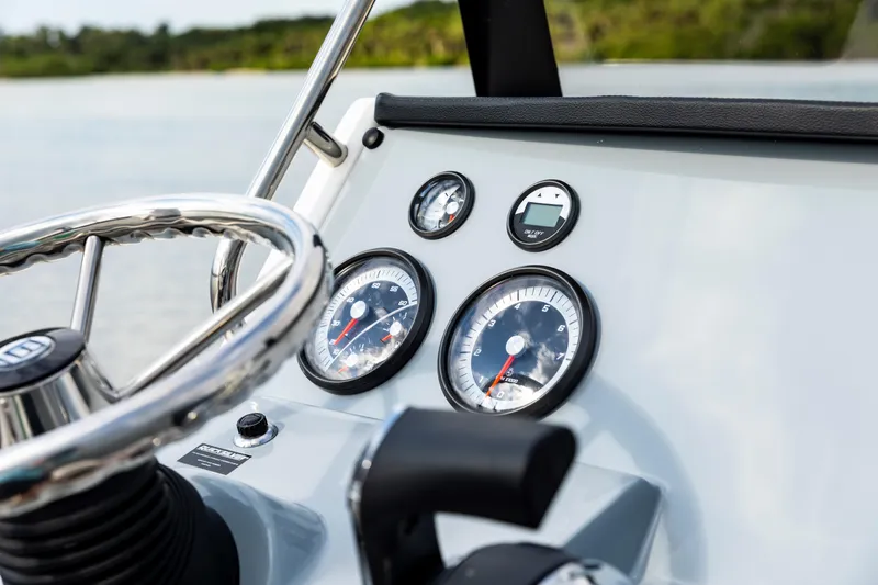 Slide: The Image of Close-up of 2023 Bayliner Trophy 20CC boat dashboard with steering wheel and gauges. - 26