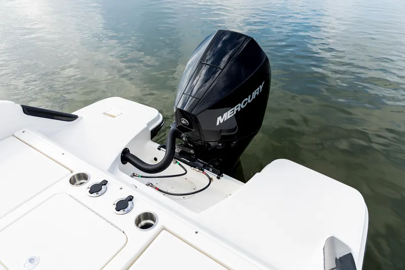 Slide: The Image of 2023 Bayliner Trophy 20CC boat with Mercury outboard motor on calm water. - 33